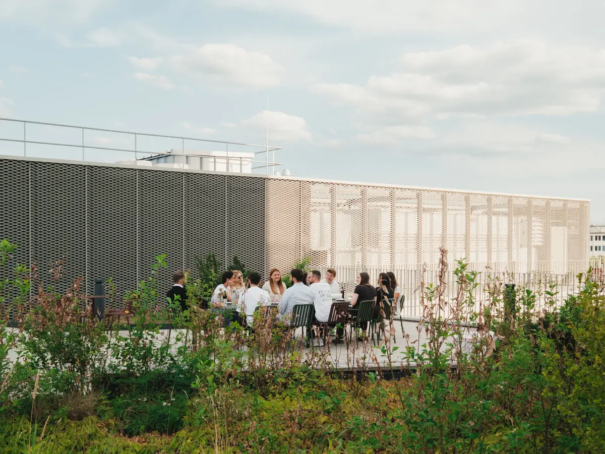 The team at the summer party on the rooftop terrace